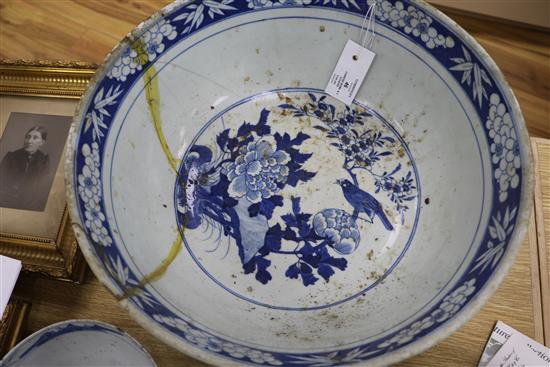 A 19th century Chinese blue and white punch bowl, Diameter 35cm. and three other bowls (a.f.)